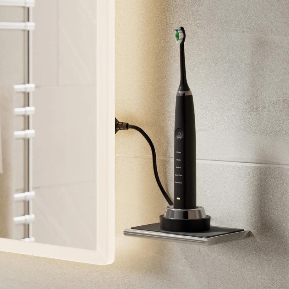 Product Lifestyle image of an electric toothbrush charging while perched on top of the HIB Shelf with Anti-Slip Mat
